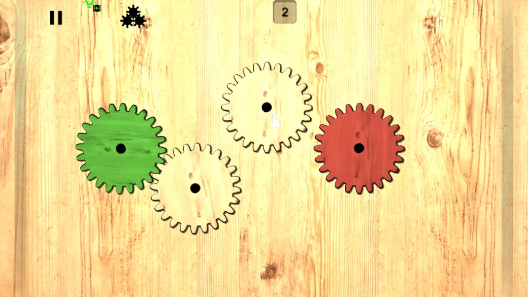 Engrenagens de madeira verde, branca e vermelha sobre uma bancada em Gears logic puzzles